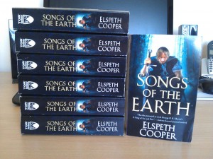 Stack of Songs of the Earth paperbacks